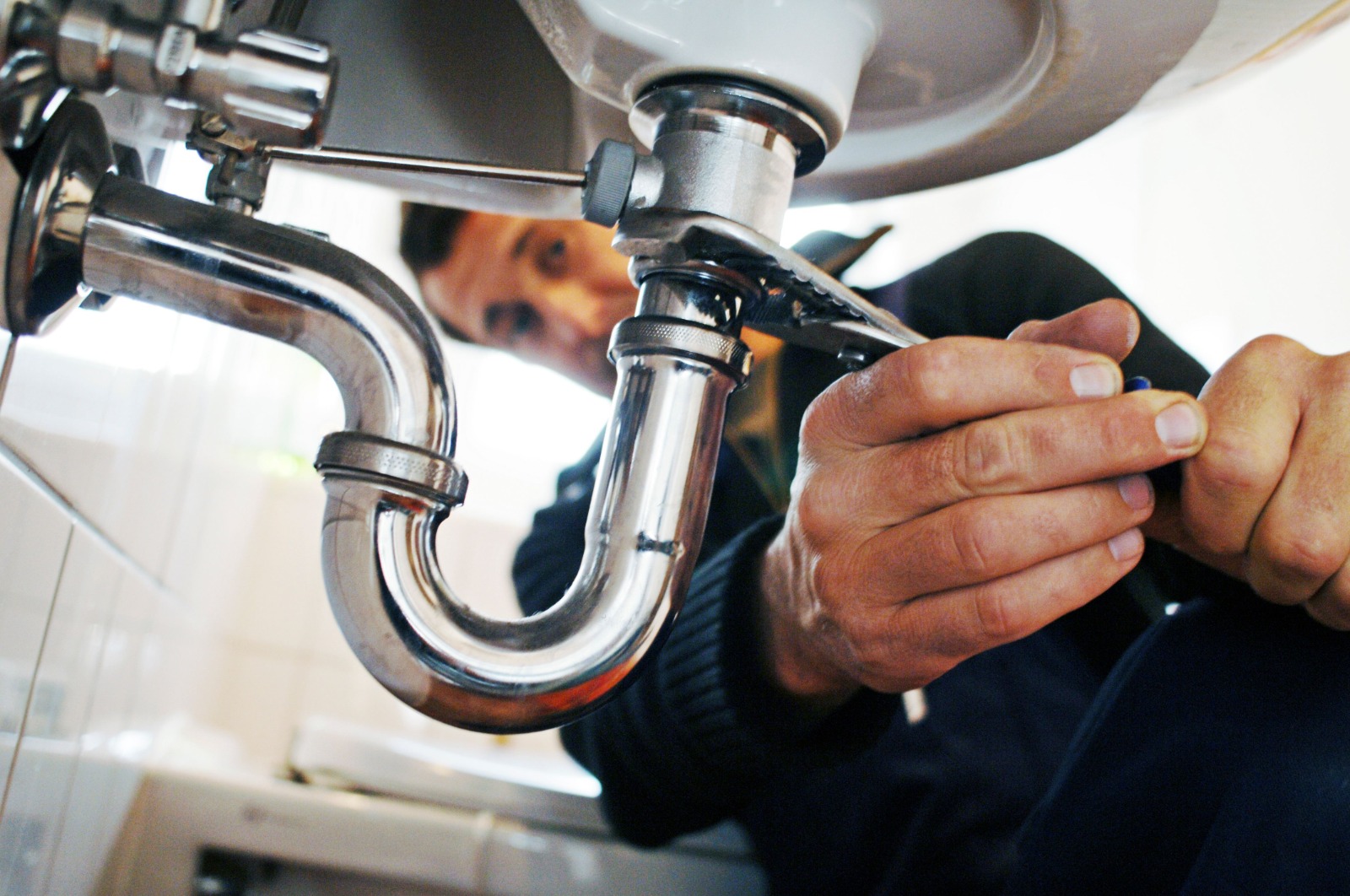 Professional plumber at work